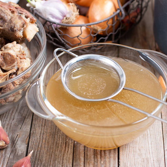 Freshly prepared low-carb bone broth to replenish electrolytes and sodium during keto flu